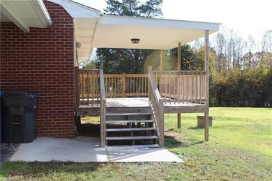 steps from carport onto your beautiful covered deck! great for grocery day.