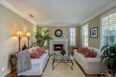 Inviting formal living room with a stone faced fir