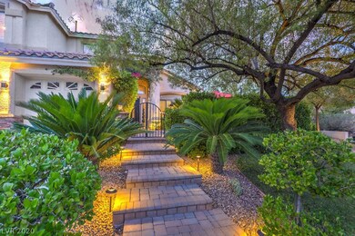 Beautiful landscaping, paver walkway leads into a