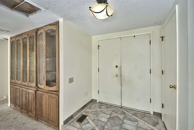 Inviting tiled entryway greets you and welcomes yo