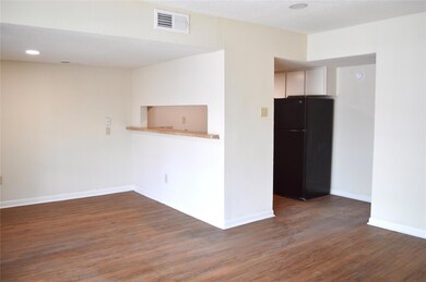 Unfurnished room featuring wood finished floors, 