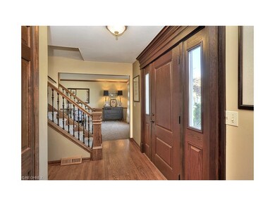 Hardwood flooring greets you in the foyer and much