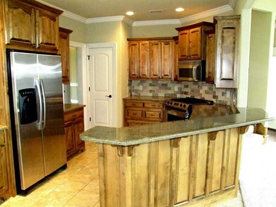 Kitchen. Stainless appliances all convey.  Gas Range