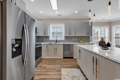 Kitchen featuring appliances with stainless steel 