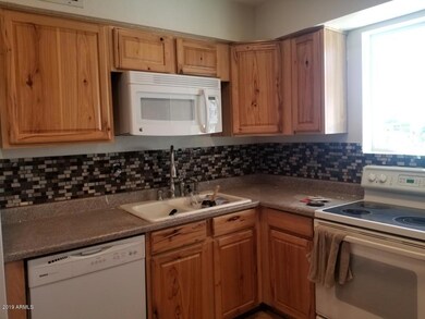 8727 e university 1
