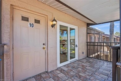 Entrance to property with stucco siding