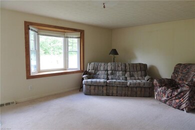 The living room and bay window.