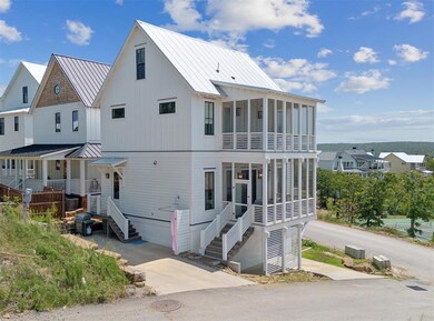 View of front of home featuring metal roof and a s