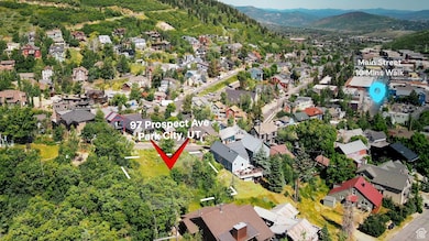 Aerial view of property's location featuring nearby suburban area