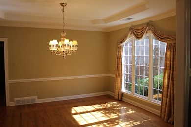 Beautiful formal dining room with large picture wi