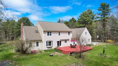 Back yard features a large deck,...
