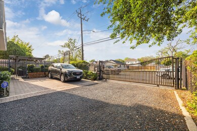This photo showcases a spacious driveway with a gr