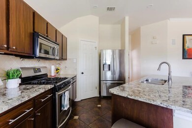 Kitchen featuring appliances with stainless steel