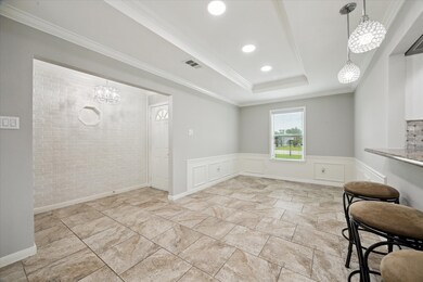 Bright dining area with modern recessed lighting,