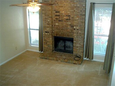 Large family room with wood burning fireplace.