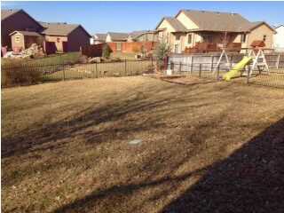 Fenced Yard with Sprinkler System