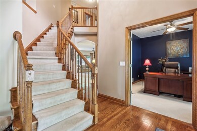 2 Story Foyer featuring hardwood floors.  French Doors lead to office