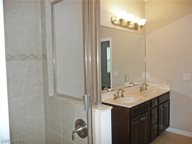The large ensuite Master Bath has twin basins, woo