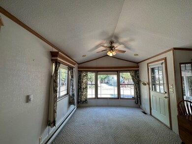 Living Room With Vaulted Ceiling & Large Windows