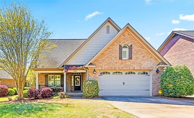 Lovely brick exterior and inviting front porch.