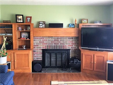 Family room with hard wood floors, built ins and w