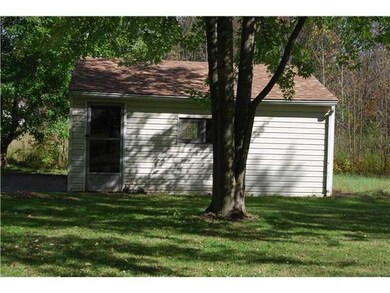 Yard/Garden. Garage side.