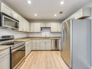 Kitchen with appliances with stainless steel finis