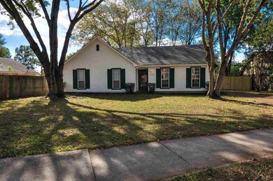 Beautiful shade trees highlight the front of this 