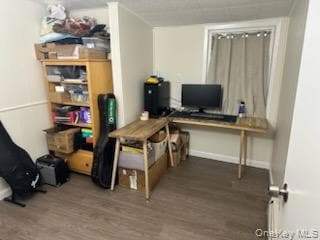 Office featuring wood finished floors and baseboards
