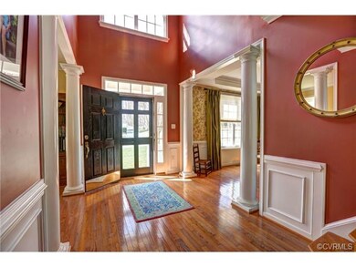 Two story foyer with natural light, columns, detai