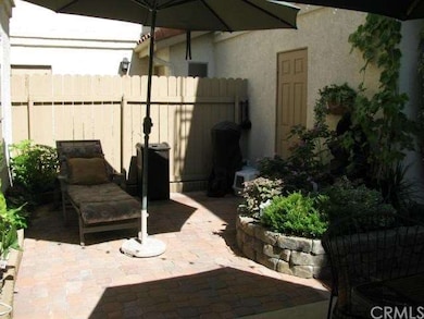 Private enclosed patio w/ brick pavers & waterfall