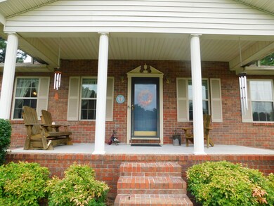 Sit a spell with family and friends on your covered front porch. 