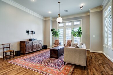 High ceilings and hardwood floors make this living