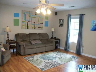 Large, open family room with laminate floors and n