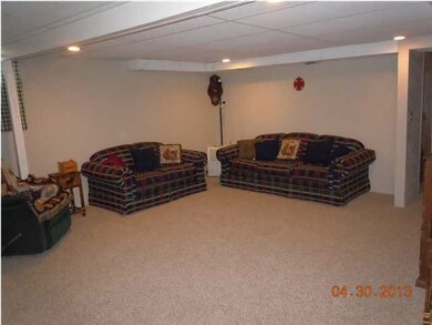 FAMILY ROOM IN THE BASEMENT WITH NEW CARPET!