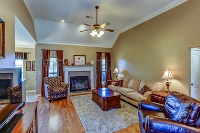 Spacious Great Room is open to the Dining Room and to the well appointed kitchen!  Gorgeous nail down flooring makes the room warm and inviting!