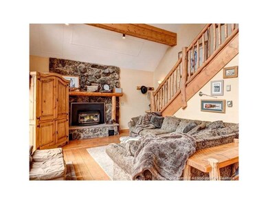 Living Room with Log Hand Hewn Staircase