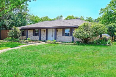 Ranch-style house with a front yard