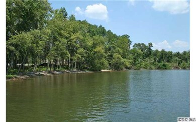 Land - View of property from lake:  lots of hardwo