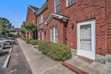 View of exterior entry with brick siding