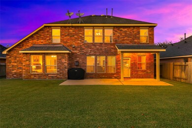 Another view of the back of the home. This yard is a blank canvas for you to create your own backyard oasis!