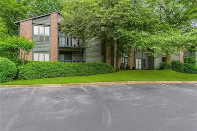 View of Condo Exterior featuring brick siding