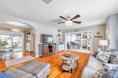 living room looking to office and dining area