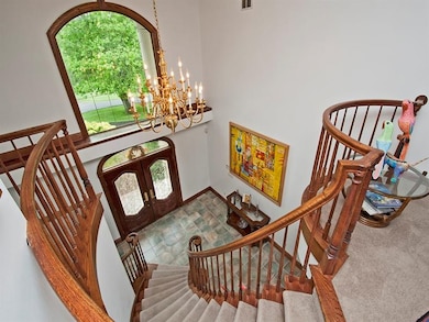 The entry foyer from above. Beautiful leaded glass