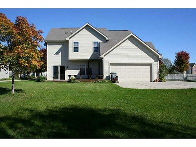 Exterior Back. Huge yard with loads of possibilities! Enjoy an evening fire in the river rock fire pit!