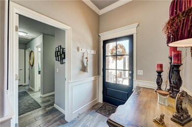 Pretty entry way with wainscoating and crown. The 