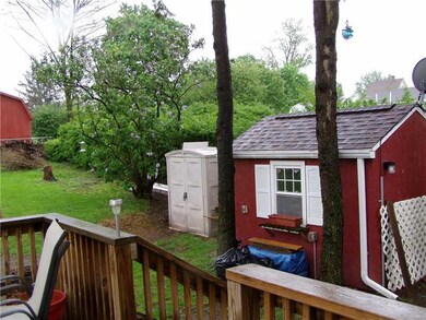 Exterior Back. Shed sits to the right of the prope