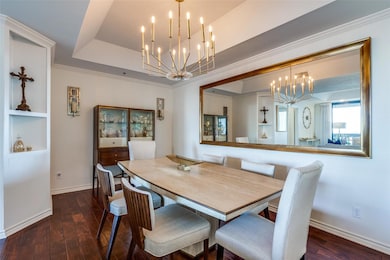 Dining area with wood-type flooring, a notable cha