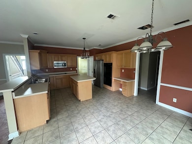 Kitchen with appliances with stainless steel finis