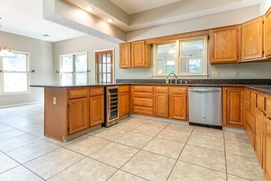 Spacious kitchen with granite counters, stainless 